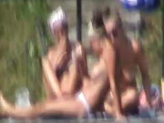 Topless teen sunbathing