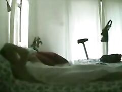 My mum masturbating on bed. Hidden cam