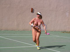 Nude playing tennis
