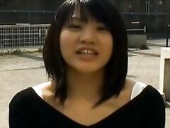 Kinky and cute Asian chick is masturbating in public.