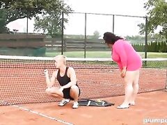 Obese woman facesits on her trainer at the tennis court